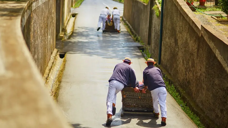 Toboggan riders in Funchal. Madeira Toboggan riders in Funchal. Madeira